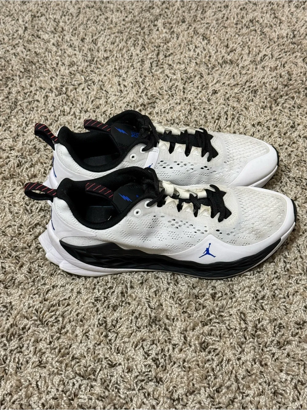 Jordan Men's White Athletic Shoes with Black and Blue Accents